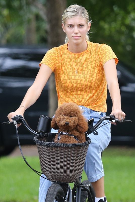 DEVON WINDSOR Out Riding a Bike with Her Dog in Miami 06/06/2020