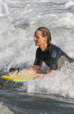 HELEN HUNT in Wetsuit Bodyboarding at a Beach in Malibu 06/13/2020