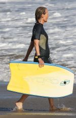 HELEN HUNT in Wetsuit Bodyboarding at a Beach in Malibu 06/13/2020