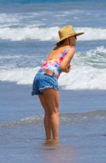 KATE HUDSON in Swimsuit and Denim Shorts Out on the Beach in Malibu 06/22/2020