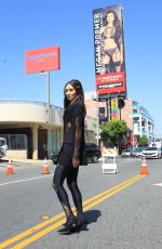 MEGAN PORMER in Front of Her Billboard on Sunset Blvd in Hollywood 06/04/2020