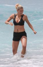 MICHELLE HUNZIKER in Bikini Top and Shorts at a Beach in Varigotti 06/06/2020