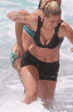 MICHELLE HUNZIKER in Bikini Top and Shorts at a Beach in Varigotti 06/06/2020