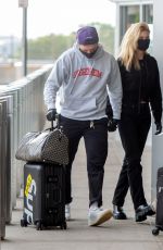 NICOLA PELTZ and Brooklyn Beckham at JFK AIrport in New York 06/25/2020