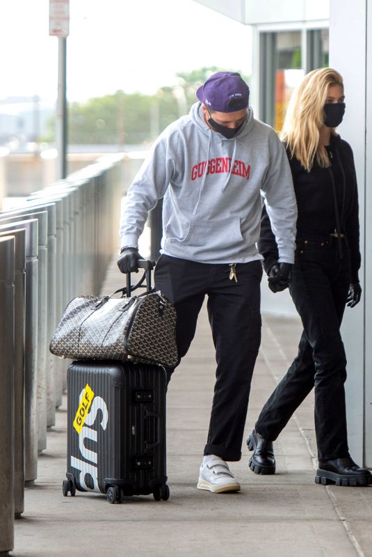 NICOLA PELTZ and Brooklyn Beckham at JFK AIrport in New York 06/25/2020