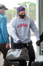 NICOLA PELTZ and Brooklyn Beckham at JFK AIrport in New York 06/25/2020