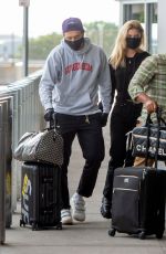 NICOLA PELTZ and Brooklyn Beckham at JFK AIrport in New York 06/25/2020