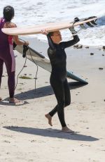 ROBIN WRIGHT Surfing at a Beach in Malibu 06/12/2020