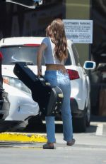 CAMILA MORRONE in Ripped Denim at Norman