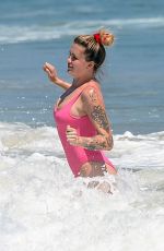 IRELAND BALDWIN in a Pink Swimsuit on the Beach in Malibu 07/20/2020