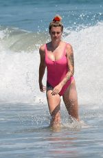 IRELAND BALDWIN in a Pink Swimsuit on the Beach in Malibu 07/20/2020