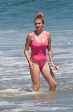 IRELAND BALDWIN in a Pink Swimsuit on the Beach in Malibu 07/20/2020