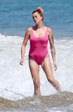 IRELAND BALDWIN in a Pink Swimsuit on the Beach in Malibu 07/20/2020