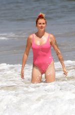 IRELAND BALDWIN in a Pink Swimsuit on the Beach in Malibu 07/20/2020