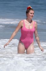 IRELAND BALDWIN in a Pink Swimsuit on the Beach in Malibu 07/20/2020