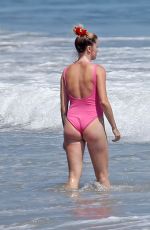 IRELAND BALDWIN in a Pink Swimsuit on the Beach in Malibu 07/20/2020