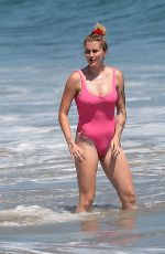 IRELAND BALDWIN in a Pink Swimsuit on the Beach in Malibu 07/20/2020