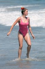 IRELAND BALDWIN in a Pink Swimsuit on the Beach in Malibu 07/20/2020