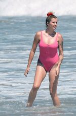 IRELAND BALDWIN in a Pink Swimsuit on the Beach in Malibu 07/20/2020