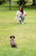LAUREN GOODGER Playing with Her Do at a Park in Essex 07/27/2020