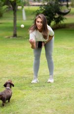 LAUREN GOODGER Playing with Her Do at a Park in Essex 07/27/2020