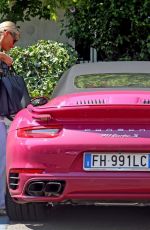 MICHELLE HUNZIKER Drives Her Pink Porsche Out in Milan 07/28/2020