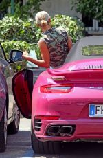 MICHELLE HUNZIKER Drives Her Pink Porsche Out in Milan 07/28/2020