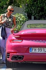 MICHELLE HUNZIKER Drives Her Pink Porsche Out in Milan 07/28/2020