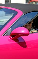 MICHELLE HUNZIKER Drives Her Pink Porsche Out in Milan 07/28/2020