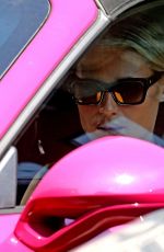 MICHELLE HUNZIKER Drives Her Pink Porsche Out in Milan 07/28/2020