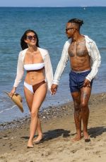 REBECCA GORMLEY in Bikini and Biggs Chris at a Beach in Spain 07/27/2020