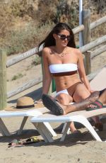 REBECCA GORMLEY in Bikini and Biggs Chris at a Beach in Spain 07/27/2020