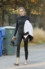 CARA DELEVINGNE in Wetsuit Out Surfing in Malibu 08/18/2020