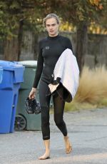 CARA DELEVINGNE in Wetsuit Out Surfing in Malibu 08/18/2020