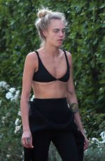 CARA DELEVINGNE in Wetsuit Out Surfing in Malibu 08/18/2020