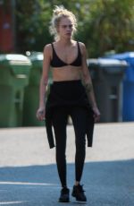CARA DELEVINGNE in Wetsuit Out Surfing in Malibu 08/18/2020