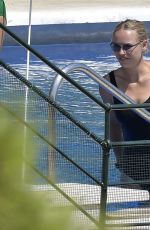 CAROLINE WOZNIACKI in a Black Swimsuit at a Pool in Italy 08/10/2020