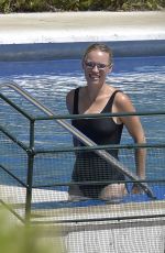 CAROLINE WOZNIACKI in a Black Swimsuit at a Pool in Italy 08/10/2020