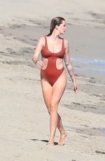 IRELAND BALDWIN in a Red Swimsuit at a Beach in Malibu 07/31/2020