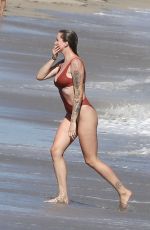 IRELAND BALDWIN in a Red Swimsuit at a Beach in Malibu 07/31/2020