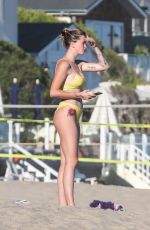 IRELAND BALDWIN in a Yellow Swimsuit on the Beach in Malibu 08/10/2020