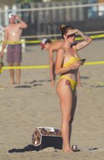 IRELAND BALDWIN in a Yellow Swimsuit on the Beach in Malibu 08/10/2020