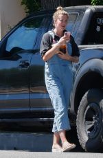 IRELAND BALDWIN in Denim Overalls Out for Iced Coffee in Los Angeles 08/10/2020