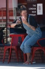 IRELAND BALDWIN in Denim Overalls Out for Iced Coffee in Los Angeles 08/10/2020