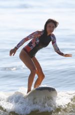 BETHENNY FRANKEL in Swimsuit Surfing at a beach in The Hamptons 09/08/2020