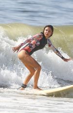 BETHENNY FRANKEL in Swimsuit Surfing at a beach in The Hamptons 09/08/2020