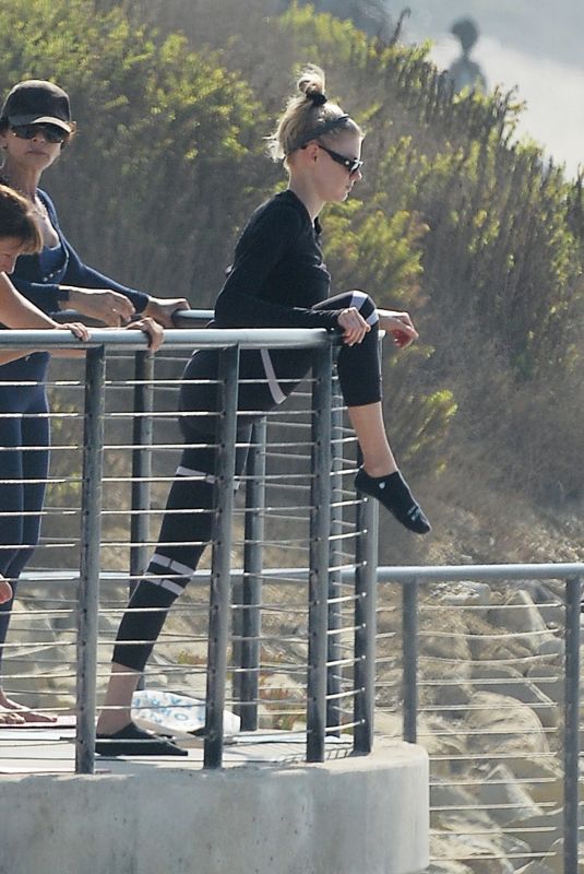 CHARLOTTE MCKINNEY Doing Yoga with Friends at a Beach in Malibu 09/23/2020