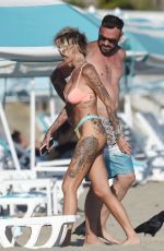 TINA LOUISE in Bikini and Brian Austin Green at a Beach in Los Angeles 08/31/2020
