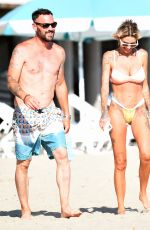 TINA LOUISE in Bikini and Brian Austin Green at a Beach in Los Angeles 08/31/2020