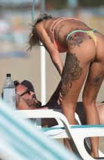 TINA LOUISE in Bikini and Brian Austin Green at a Beach in Los Angeles 08/31/2020